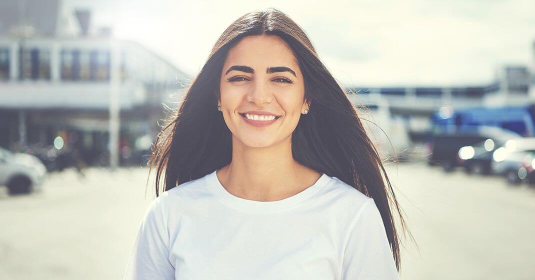 woman standing and smiling