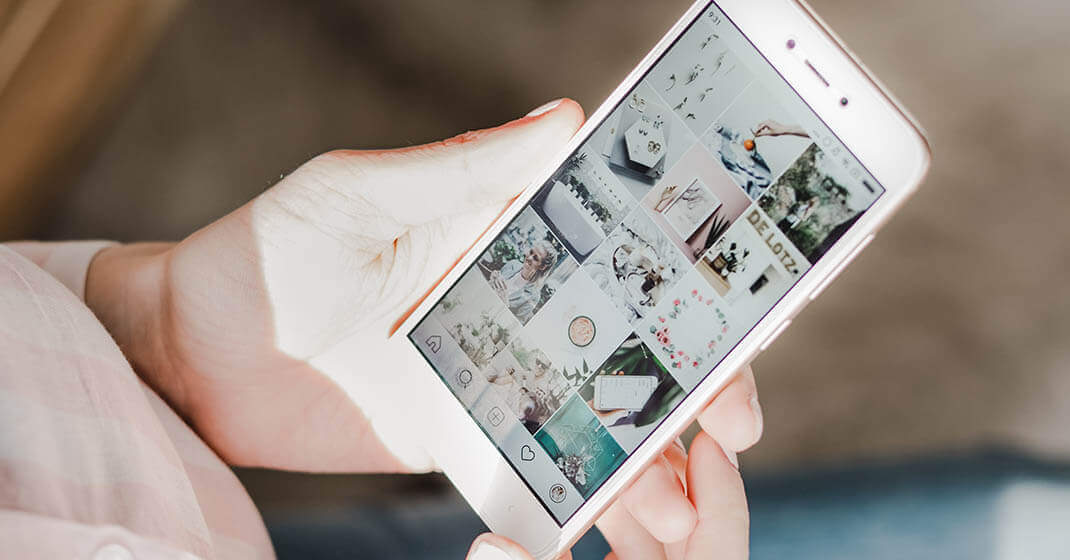 woman using phone to look at Instagram