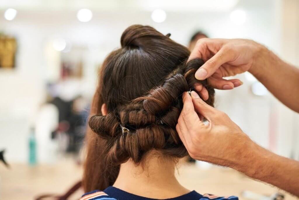 woman getting her hair done in hair salon