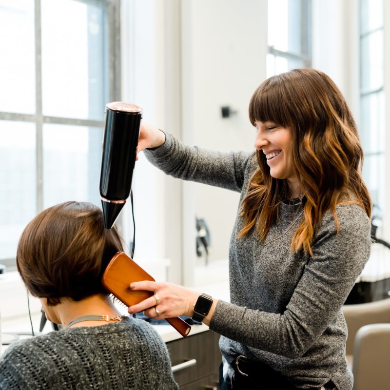 hairdresser-blow-drying-clients-hair