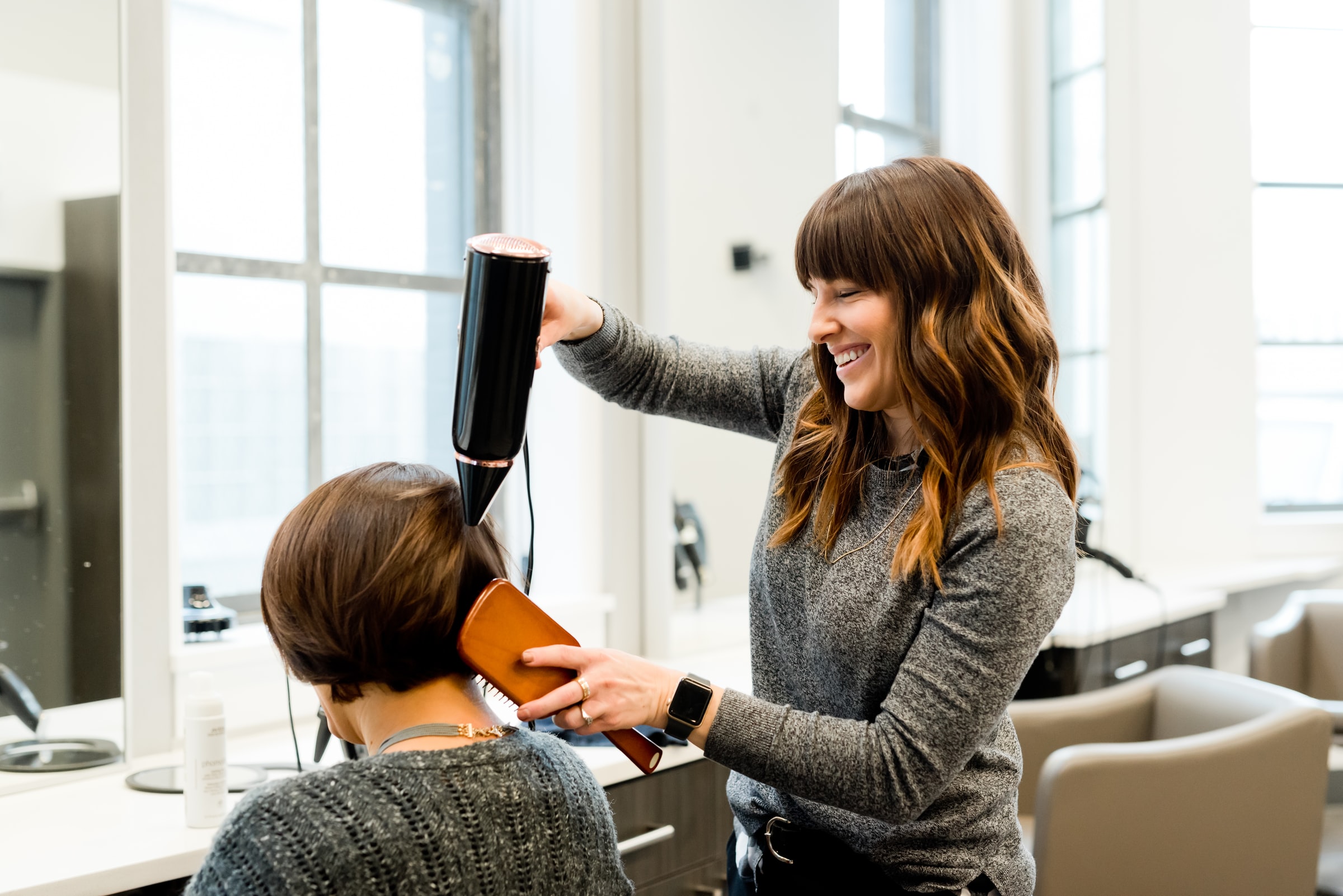 hairdresser-blow-drying-clients-hair