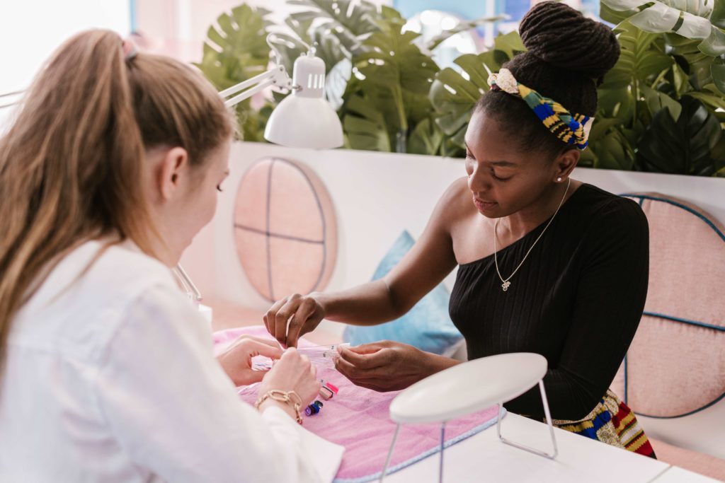 Customer having nails done at unique salon