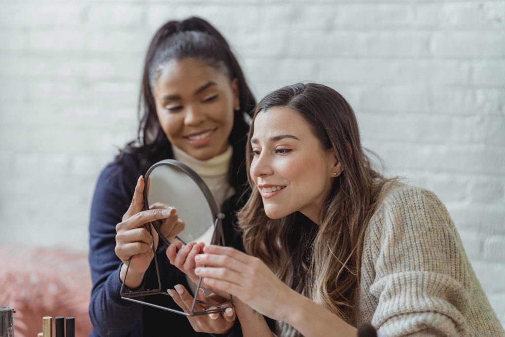 customer looking in mirror at beauty salon